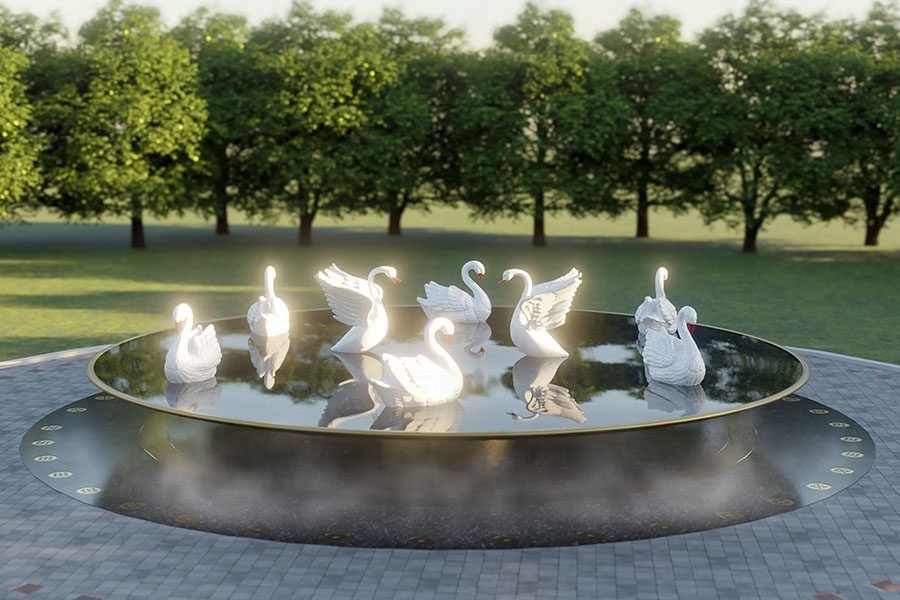 swans swimming in round lake water and art feature