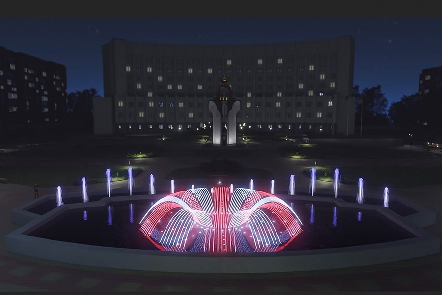 night illuminated fountain with purple and white water features in city square