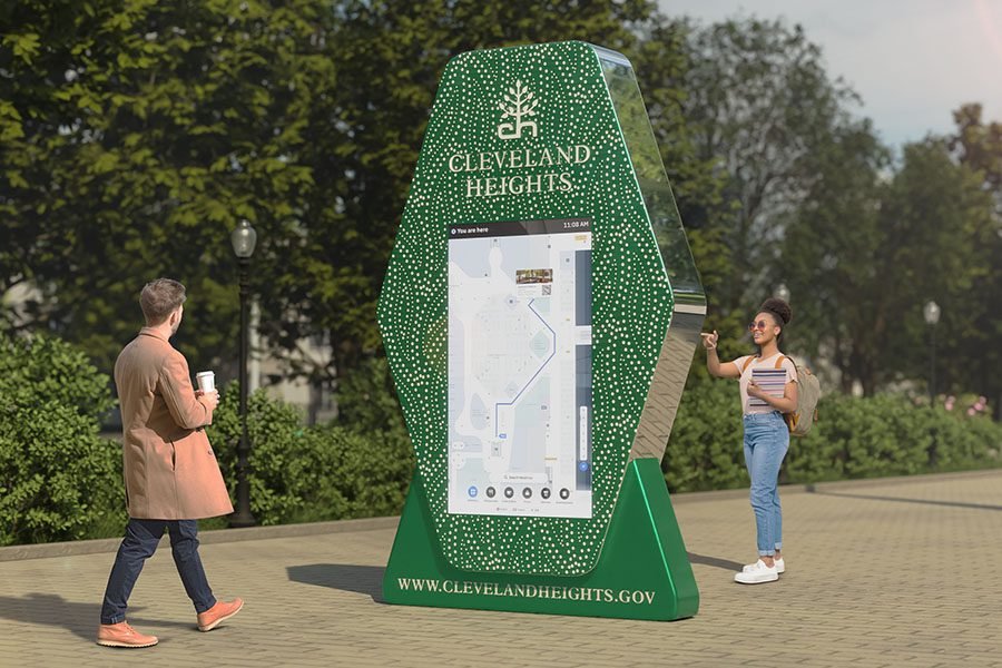 perforated metal wayfinding sculpture with digital navigation screen at park entrance