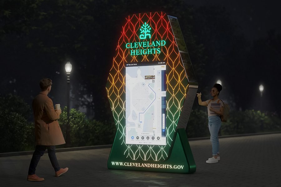 urban navigation screen integrated into perforated metal sculpture near park