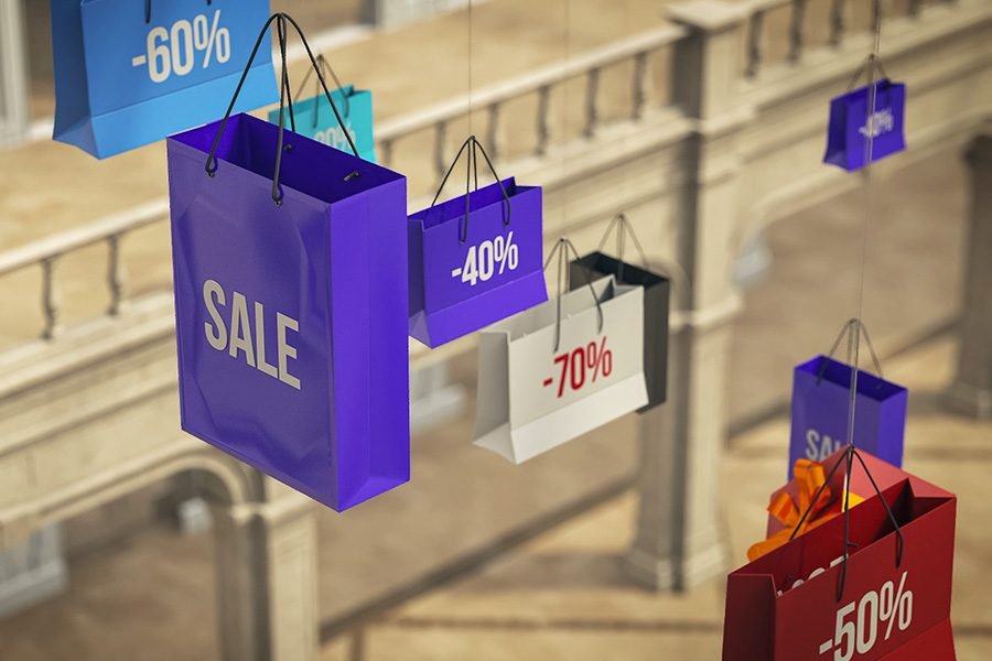 floating kinetic display of sale bags in retail mall