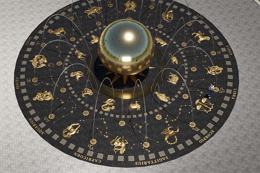 illuminated zodiac fountain with metal sphere and constellations at night