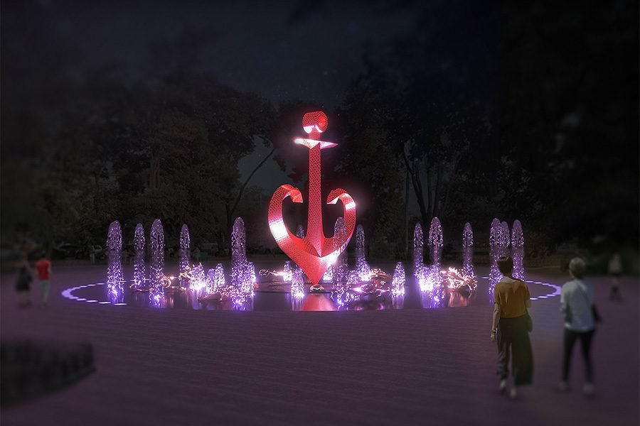red LED anchor fountain with illuminated water jets at night