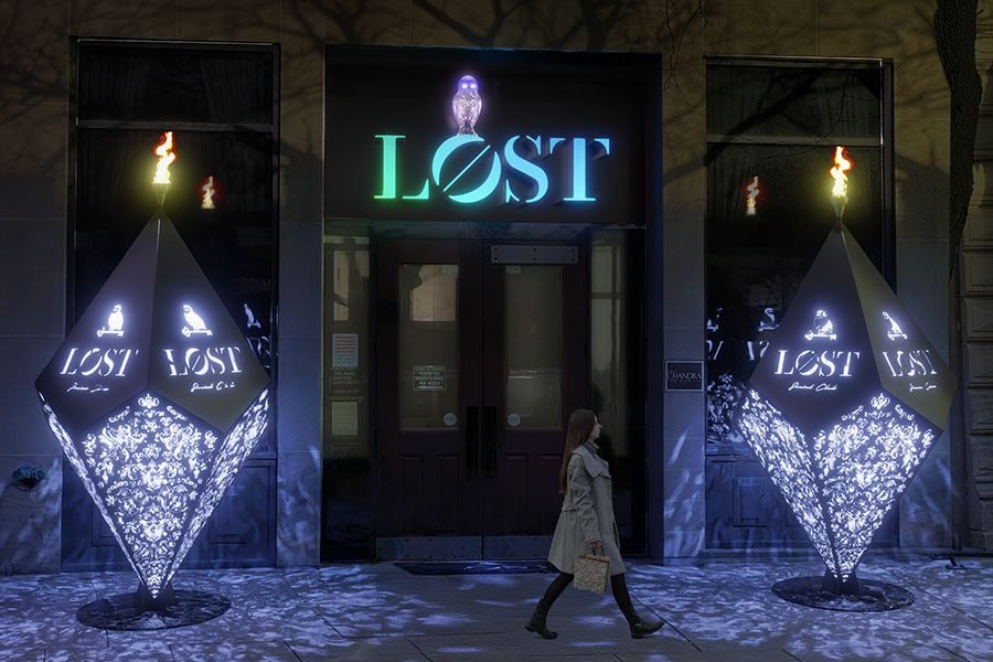 LED-lit perforated metal entry sculptures with logo branding
