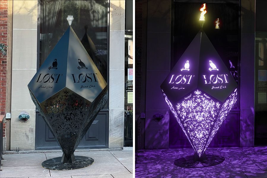 metal projection art installation at storefront