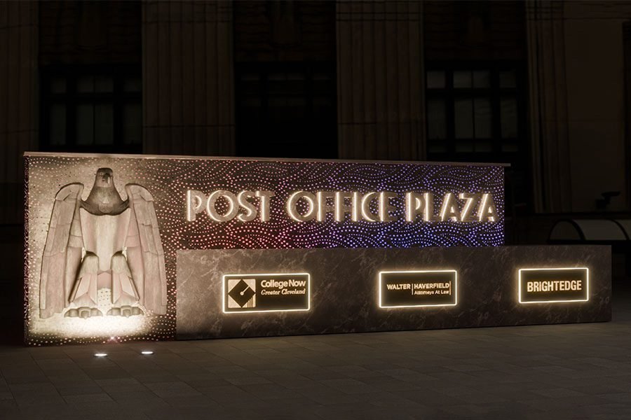 Illuminated metal and stone post office entry sculpture