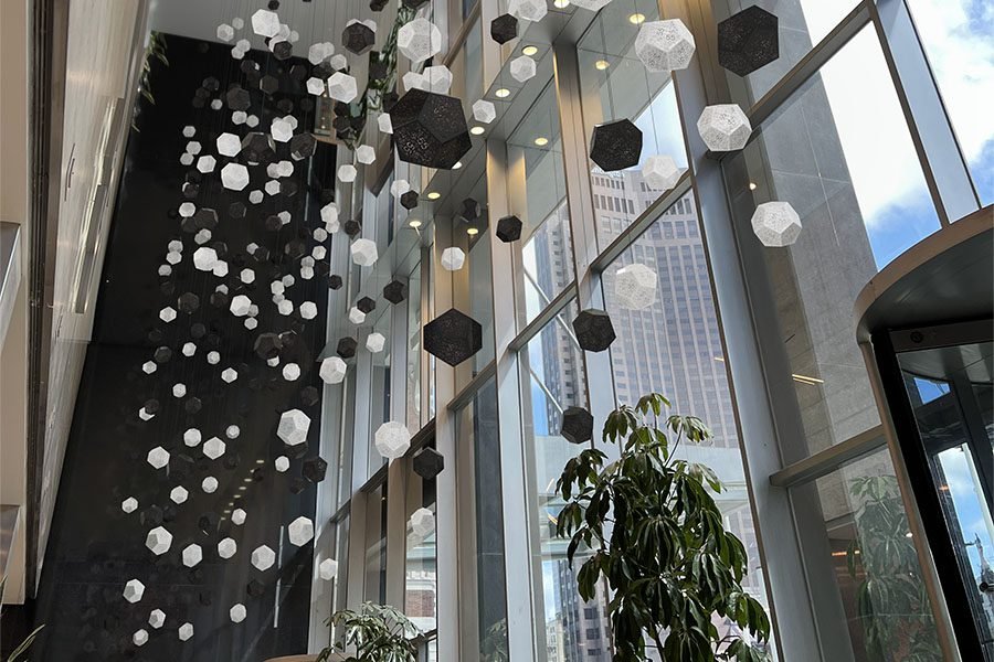 Suspended geometric kinetic moving light installation