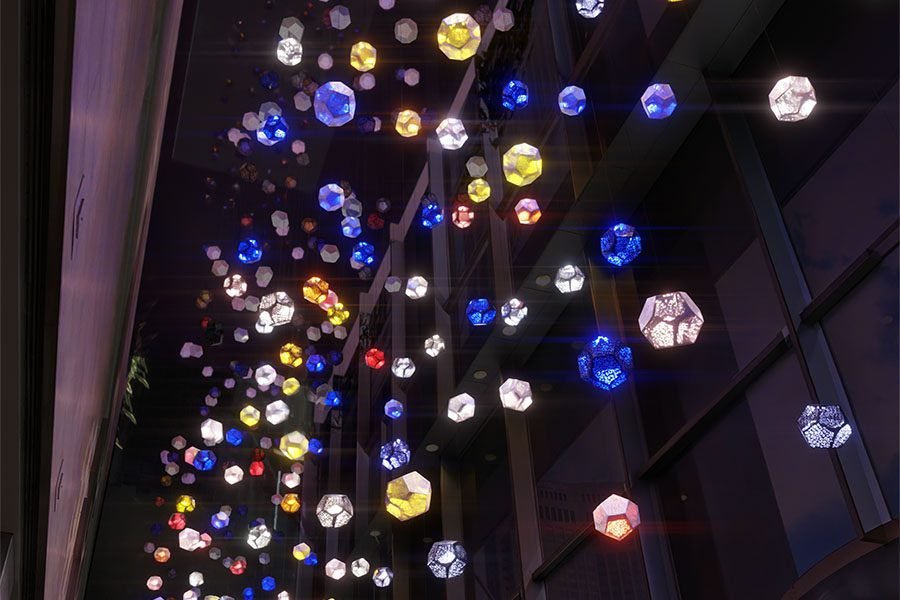 Suspended geometric light installation in modern atrium