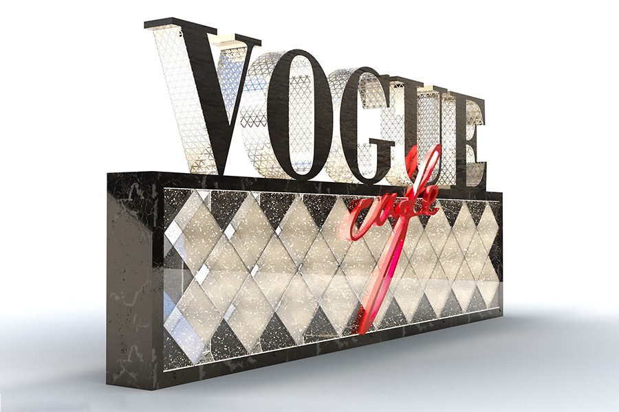 custom VOGUE Cafe sign with illuminated glass panel and metal lettering