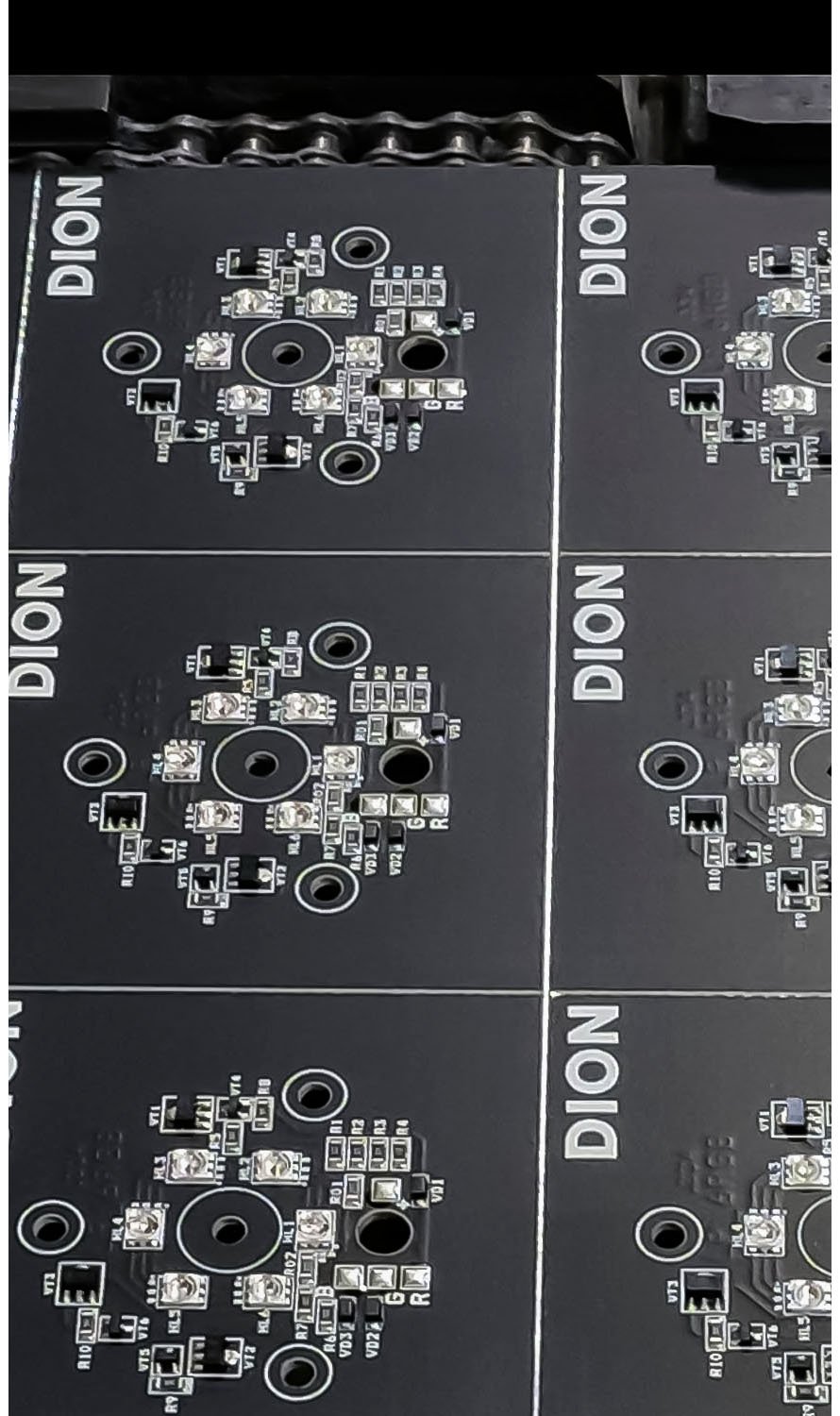 Close-up of custom electronic circuit boards with the DION logo