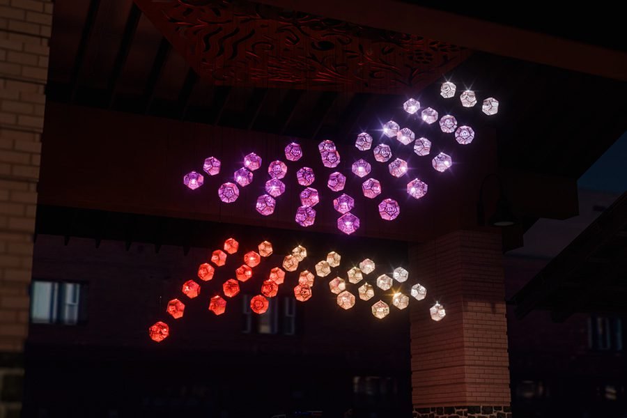 Five Elements Kinetic installation at night with gradient lighting
