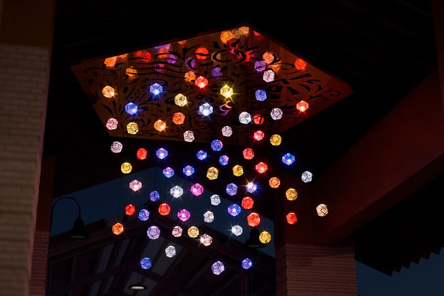 nighttime view of the Five Elements installation with all kinetic light modules illuminated